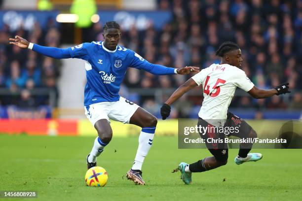 Amadou Onana of Everton in action with Romeo Lavia of Southampton during the Premier League match between Everton FC and Southampton FC at Goodison...