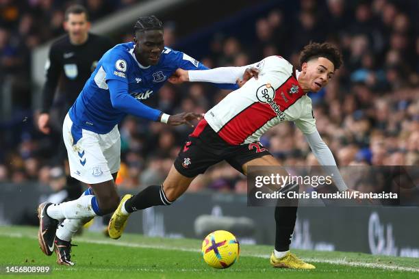 Amadou Onana of Everton in action with Samuel Edozie of Southampton during the Premier League match between Everton FC and Southampton FC at Goodison...