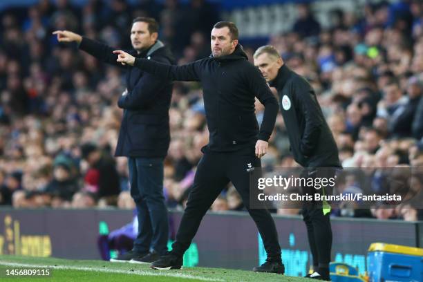 Southampton manager Nathan Jones gestures from the touchline during the Premier League match between Everton FC and Southampton FC at Goodison Park...