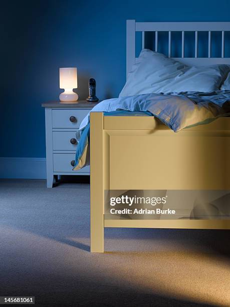 bedroom at night. - nachttisch stock-fotos und bilder