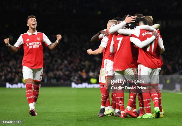 Martin Odegaard celebrates scoring Arsenal's 2nd goal with his team mates during the Premier League match between Tottenham Hotspur and Arsenal FC at...