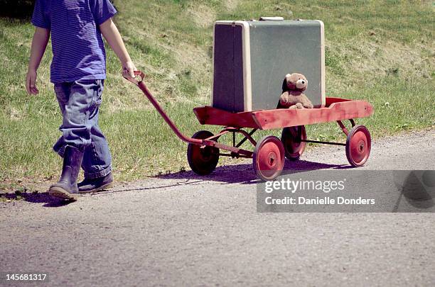 Boy Pulling Red Wagon Photos and Premium High Res Pictures - Getty Images