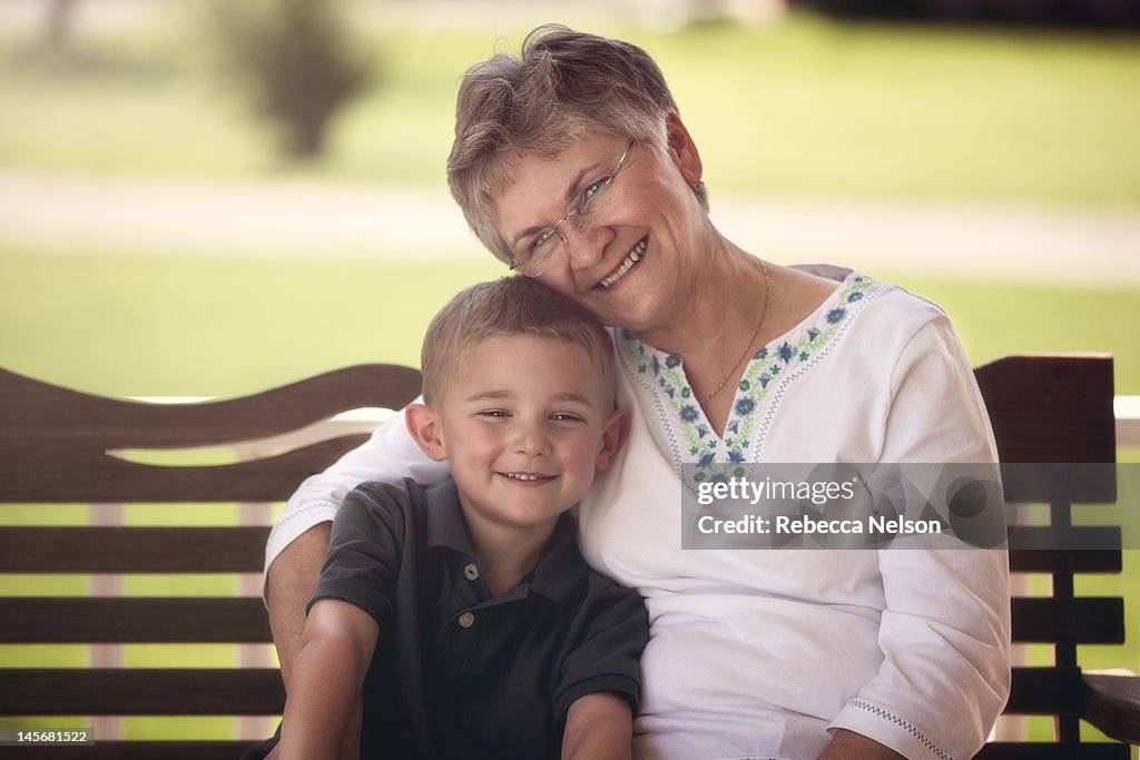 Grandmother and grandson on porch swing