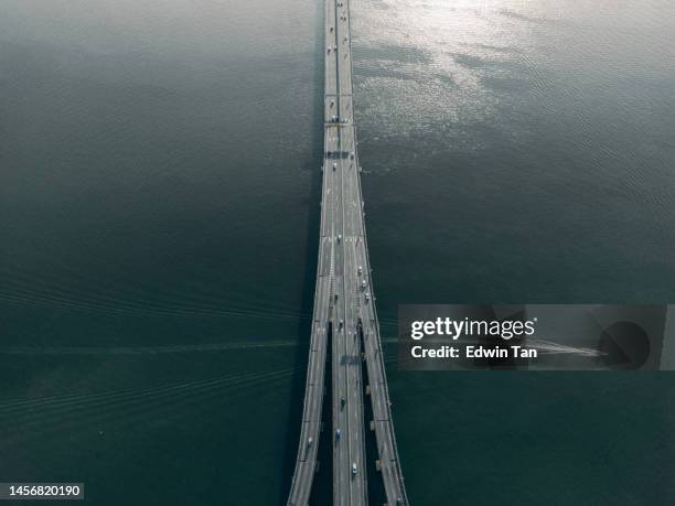 morning penang bridge drone point of view boat cruise crossing - converge stockfoto's en -beelden