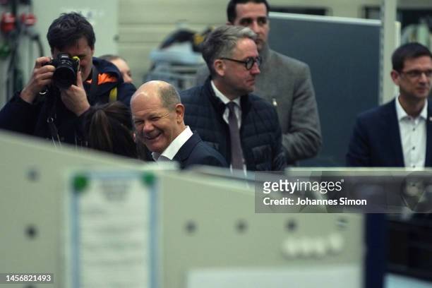 German Chancellor Olaf Scholz tours a production facility at Hensoldt, a defense contractor that specializes in sensor and radar technology on...