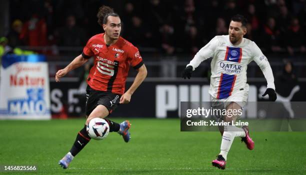 Arthur Theate of Rennes in action with Lionel Messi of Paris Saint-Germain during the Ligue 1 match between Stade Rennes and Paris Saint-Germain at...