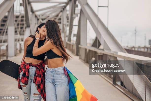 happy lesbian couple kissing - lesbians kissing stock pictures, royalty-free photos & images