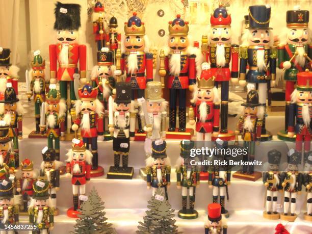 nutcrackers for sale - christmas toys wooden background foto e immagini stock