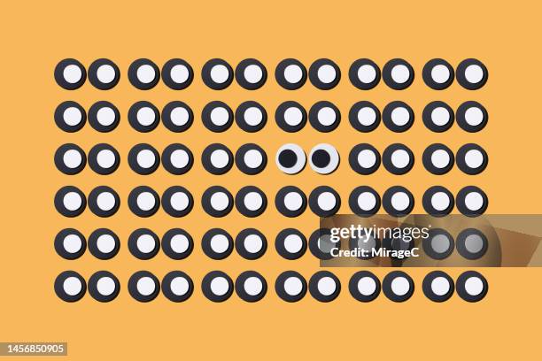 cartoon googly eyes different from the crowd - googly eyes stock pictures, royalty-free photos & images