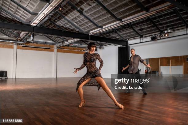 note for inspector : the property release is provided. the school has 3 different areas within one abandoned buildingbeautiful couple dancing rumba together at a rehearsal area - rumba stock pictures, royalty-free photos & images