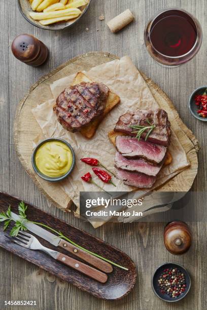 traditional meat steak barbecue on a plate - steakhouse stock pictures, royalty-free photos & images