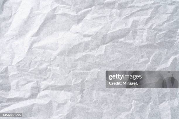 wrinkled white baking paper texture background - wachspapiere stock-fotos und bilder