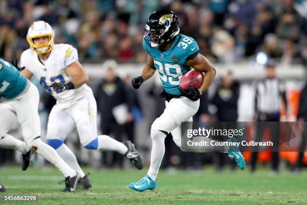 Jamal Agnew of the Jacksonville Jaguars carries the ball against the Los Angeles Chargers during the first half in the AFC Wild Card playoff game at...