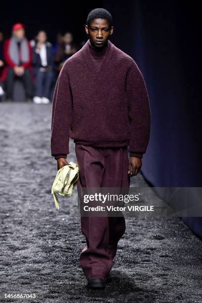 Model walks the runway during the Zegna Ready to Wear Fall/Winter 2023-2024 fashion show as part of the Milan Men Fashion Week on January 16, 2022 in...