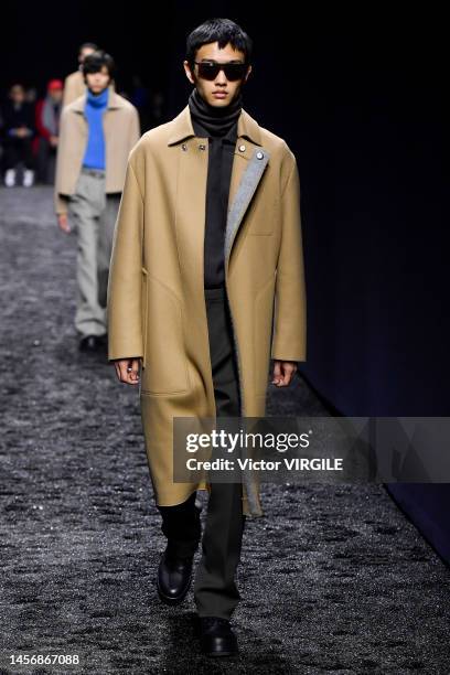 Model walks the runway during the Zegna Ready to Wear Fall/Winter 2023-2024 fashion show as part of the Milan Men Fashion Week on January 16, 2022 in...