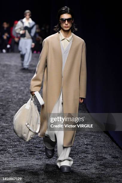 Model walks the runway during the Zegna Ready to Wear Fall/Winter 2023-2024 fashion show as part of the Milan Men Fashion Week on January 16, 2022 in...