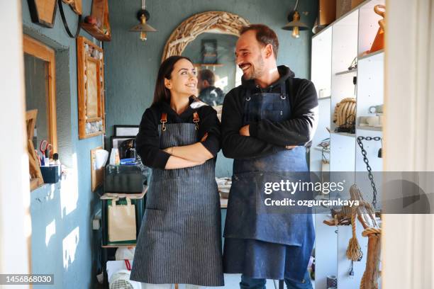 couple partner craftsman indoor working concept - retail place stock pictures, royalty-free photos & images