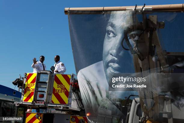 An image of Dr. Martin Luther King Jr. Hangs on the back of a sanitation department truck during the Dr. Martin Luther King Jr. Day Parade in the...
