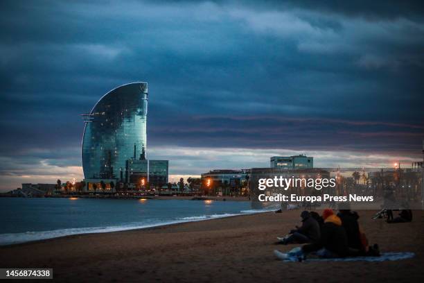 People stroll on the Barceloneta beach, on 16 January, 2023 in Barcelona, Catalonia, Spain. The Gerard squall, seventh of the season, is ahead of the...