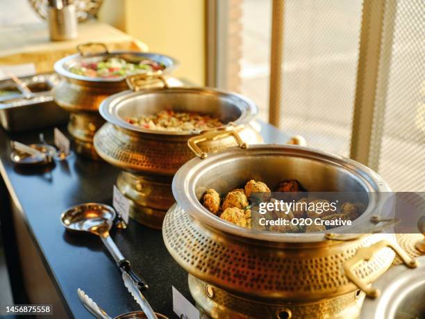 buffet in an indian restaurant - indian buffet stock pictures, royalty-free photos & images