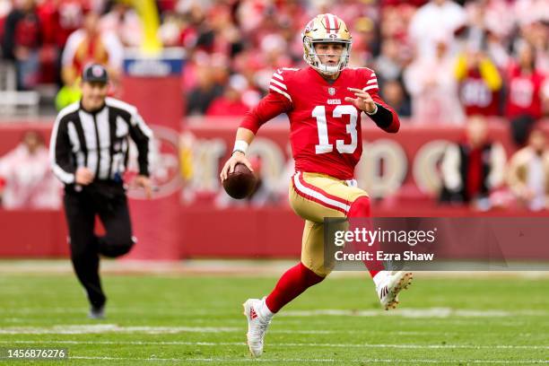 Brock Purdy of the San Francisco 49ers scrambles against the Seattle Seahawks during the first half in the NFC Wild Card playoff game at Levi's...