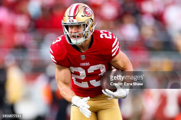 Christian McCaffrey of the San Francisco 49ers carries the ball against the Seattle Seahawks during the first half in the NFC Wild Card playoff game...