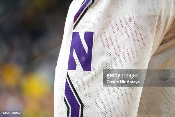 Detail is pictured of the uniform and logo of the Northwestern Wildcats against the Michigan Wolverines at Crisler Arena on January 15, 2023 in Ann...