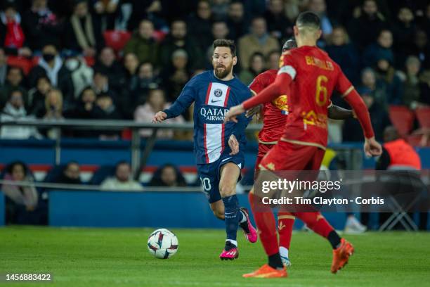 January 11: Lionel Messi of Paris Saint-Germain defended by Batista Mendy of Angers and Nabil Bentaleb of Angers during the Paris Saint-Germain V...