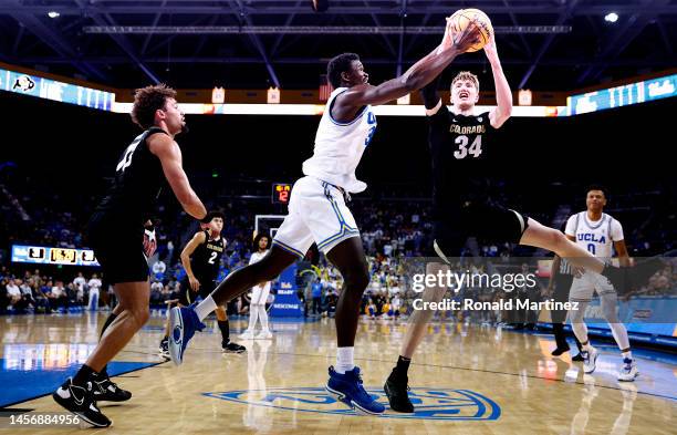 Adem Bona of the UCLA Bruins and Lawson Lovering of the Colorado Buffaloes in the second half at UCLA Pauley Pavilion on January 14, 2023 in Los...