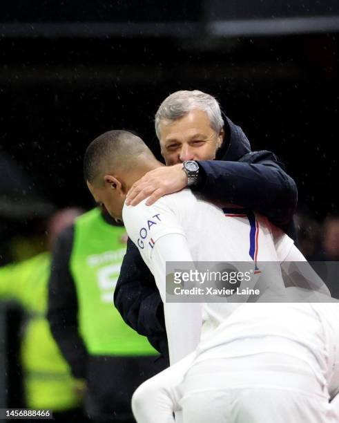 Head coach Bruno Genesio of Rennes congratulates Kylian Mbappe of Paris Saint-Germain for his superb performance in the world cup before enter the...