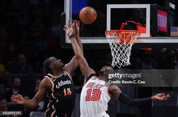 Bam Adebayo of the Miami Heat breaks up this pass to Clint Capela of the Atlanta Hawks during the first quarter at State Farm Arena on January 16,...