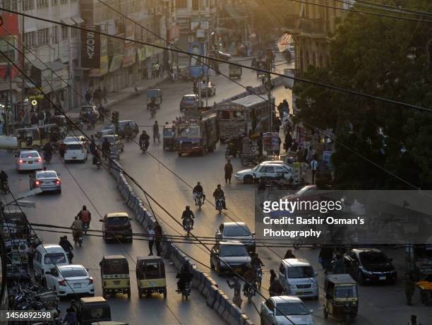 traffic moving around in the neighborhood of saddar - pakistan people stock pictures, royalty-free photos & images