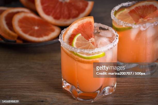close-up of drink in glass on table,ukraine - grapefruit cocktail stock pictures, royalty-free photos & images