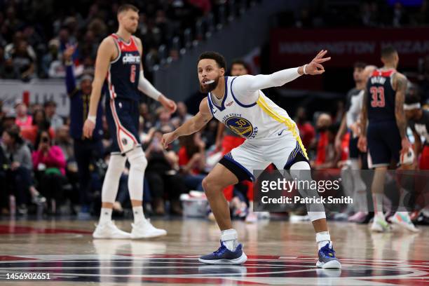Stephen Curry of the Golden State Warriors celebrates against the Washington Wizards during the second half at Capital One Arena on January 16, 2023...
