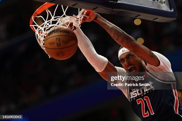 Daniel Gafford of the Washington Wizards dunks against the Golden State Warriors during the second half at Capital One Arena on January 16, 2023 in...