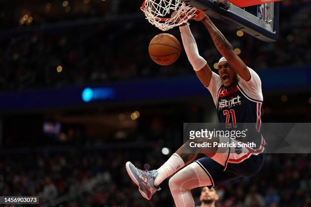 Daniel Gafford of the Washington Wizards dunks against the Golden State Warriors during the second half at Capital One Arena on January 16, 2023 in...
