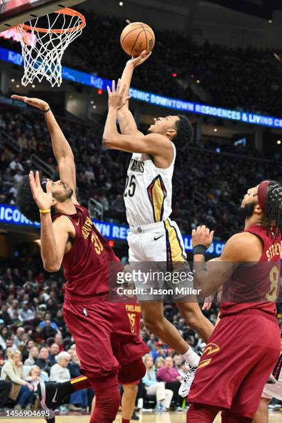 Trey Murphy III of the New Orleans Pelicans shoots over Jarrett Allen of the Cleveland Cavaliers during the fourth quarter at Rocket Mortgage...