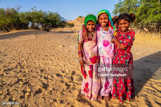 group of happy gypsy indian children, desert village, india - gipsy stock pictures, royalty-free photos & images