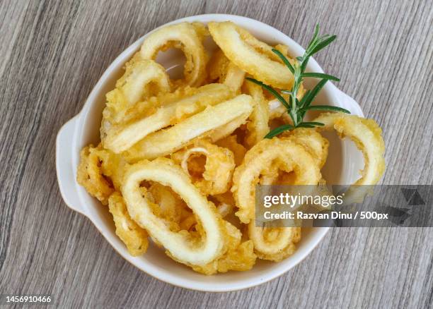 high angle view of pasta in plate on table,romania - crumbed calamari stock pictures, royalty-free photos & images