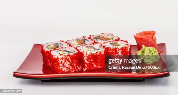 tobiko spicy maki sushi - hot roll with various type of tobiko flying fish roe outside salmon,av,romania - av roe stock pictures, royalty-free photos & images