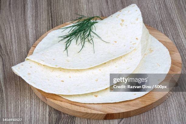 high angle view of cheese on cutting board,romania - lavash stockfoto's en -beelden