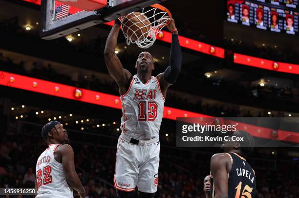 Bam Adebayo of the Miami Heat dunks against Clint Capela of the Atlanta Hawks during the second quarter at State Farm Arena on January 16, 2023 in...