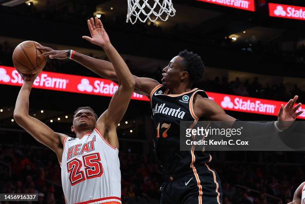 Onyeka Okongwu of the Atlanta Hawks blocks a shot by Orlando Robinson of the Miami Heat during the second quarter at State Farm Arena on January 16,...