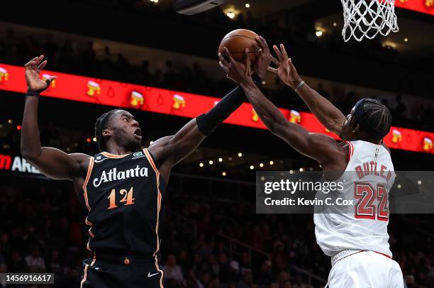 Griffin of the Atlanta Hawks grabs a rebound against Jimmy Butler of the Miami Heat during the second quarter at State Farm Arena on January 16, 2023...