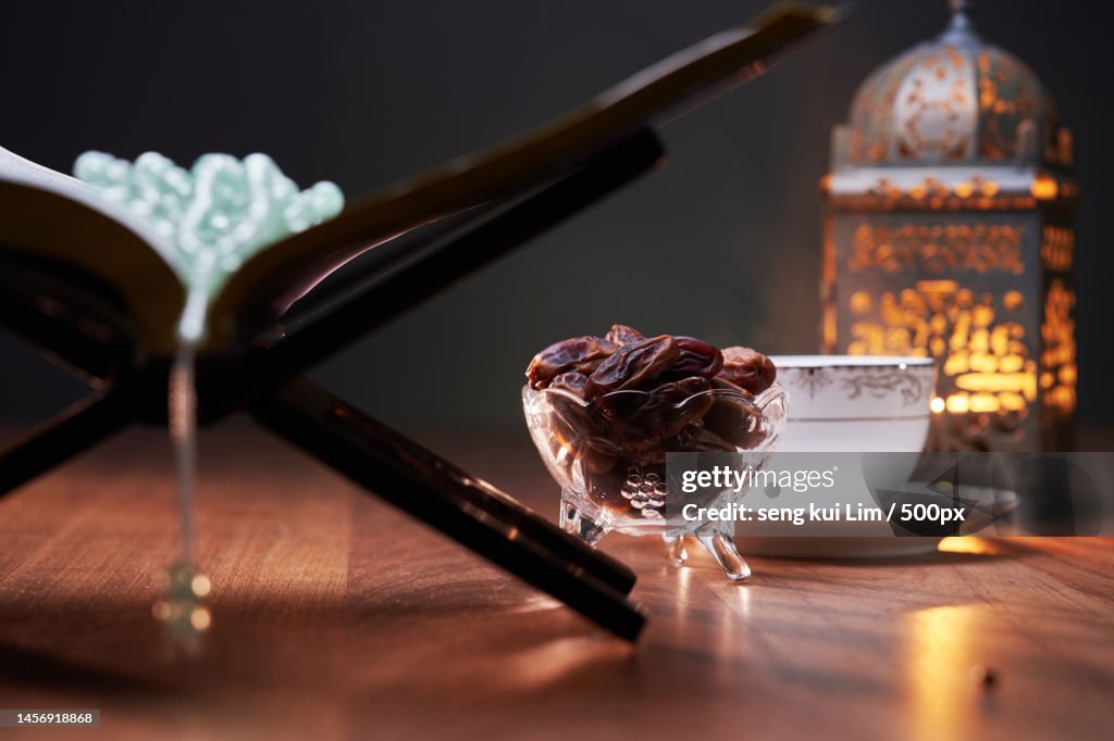 Focus on bowl of date,Hot tea koran and latern,Malaysia