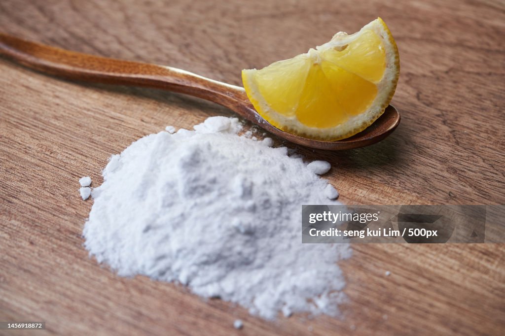 Sliced lemon and baking soda on table top,Malaysia
