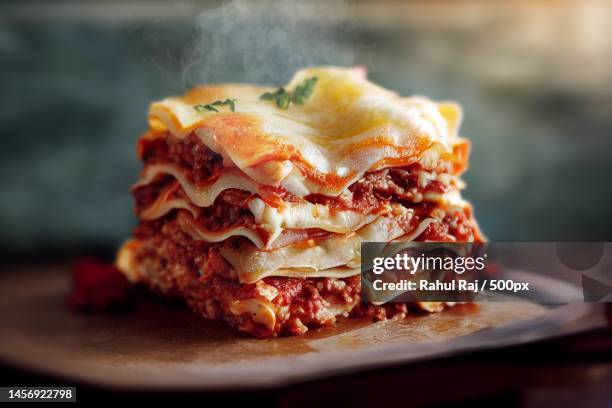 close-up of food in plate on table - lasagne stock-fotos und bilder