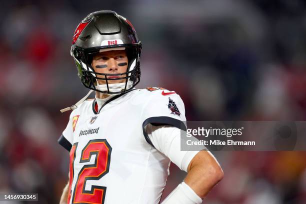 Tom Brady of the Tampa Bay Buccaneers warms up prior to a game against the Dallas Cowboys in the NFC Wild Card playoff game at Raymond James Stadium...