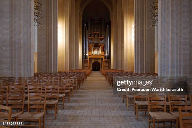 the nave atrium of grundtvig church, iconic expressionist protestant church. - christianity stock pictures, royalty-free photos & images