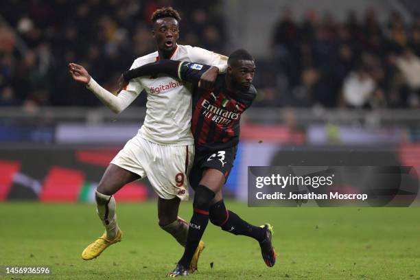 Tammy Abraham of AS Roma tussles with fellow Englishman Fikayo Tomori of AC Milan during the Serie A match between AC Milan and AS Roma at Stadio...